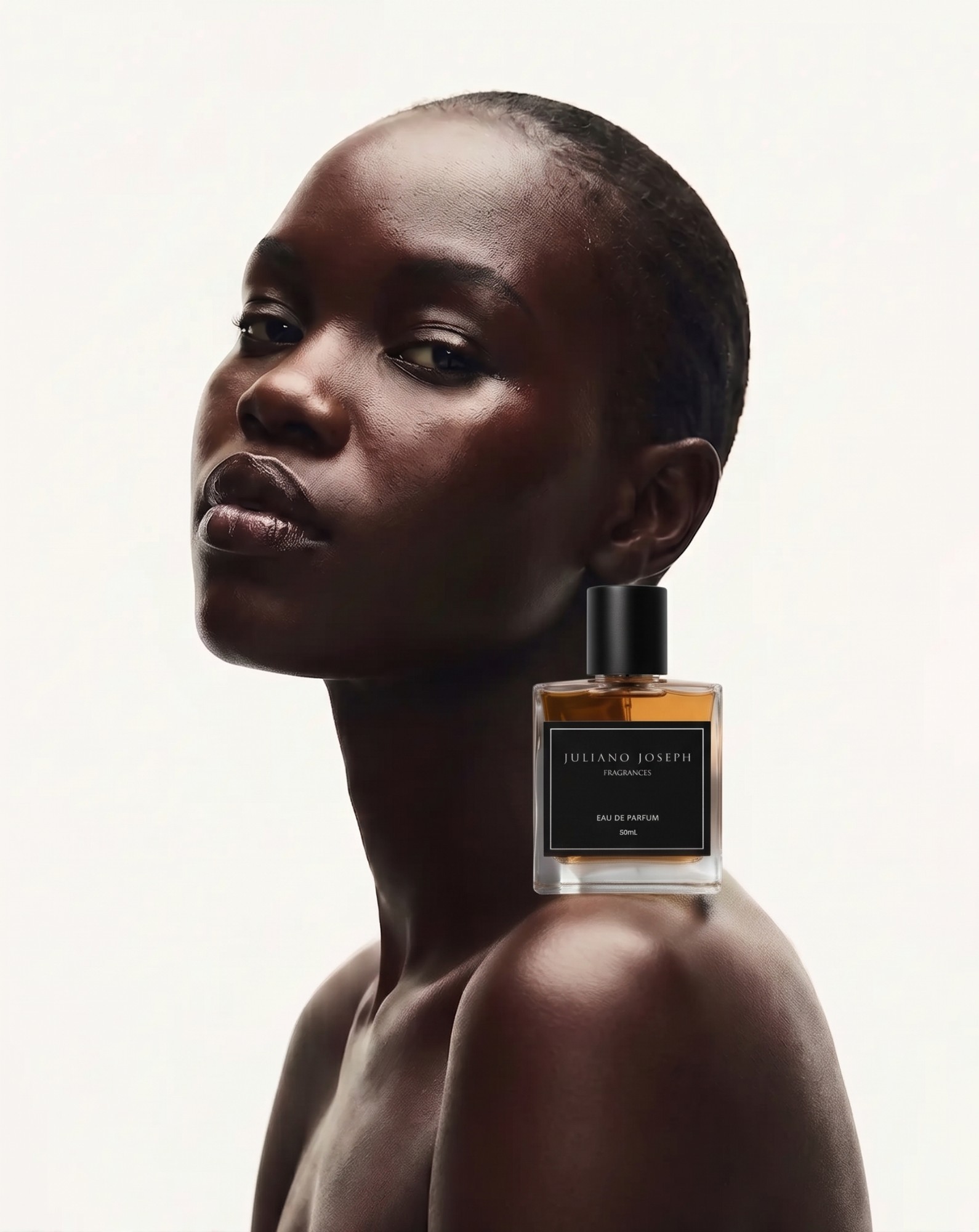 Model with a Juliano Joseph Eau de Parfum bottle resting on her shoulder